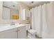 Clean bathroom with white vanity, toilet and shower at 3121 S Tamarac Dr # 201K, Denver, CO 80231