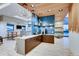 Modern community kitchen with wood accents and blue tile at 191 Freemont Ct, Brighton, CO 80601