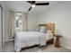 Bright bedroom with a comfortable bed and ceiling fan at 336 N Grant St # 206, Denver, CO 80203