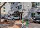 Exterior view of apartment building with parking and landscaping at 336 N Grant St # 206, Denver, CO 80203