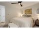 Bedroom with queen bed, ceiling fan, and access to bathroom at 336 N Grant St # 206, Denver, CO 80203