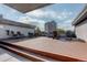 Rooftop deck with seating, table, and fireplace at 336 N Grant St # 206, Denver, CO 80203