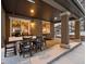 Covered patio with table and chairs, overlooking a snowy backyard at 16479 Golden Sun, Monument, CO 80132