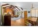 Open concept dining area and living room with hardwood floors at 6685 E Exposition Ave, Denver, CO 80224