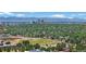 Aerial view of residential neighborhood with mountain backdrop at 6685 E Exposition Ave, Denver, CO 80224
