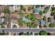 Aerial view of the house and its surroundings, showing proximity to other homes and a street at 6685 E Exposition Ave, Denver, CO 80224