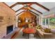 Living room featuring vaulted ceilings and wood paneling at 6685 E Exposition Ave, Denver, CO 80224