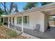 Ranch style home exterior with covered porch at 6685 E Exposition Ave, Denver, CO 80224