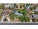 Aerial view of a house nestled among lush trees in a quiet neighborhood at 6685 E Exposition Ave, Denver, CO 80224