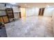 Finished basement with tiled floors and built-in shelving at 12202 E 168Th Ave, Brighton, CO 80602