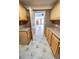 Kitchen features light wood cabinets and tile flooring at 12202 E 168Th Ave, Brighton, CO 80602