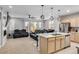 Modern kitchen island with sink, plenty of counter space and cabinets at 9804 Truckee St, Commerce City, CO 80022