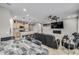 Open concept kitchen and living area with island and stainless steel appliances at 9804 Truckee St, Commerce City, CO 80022
