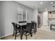 Kitchen and dining area with modern table and chairs at 9804 Truckee St, Commerce City, CO 80022