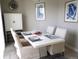 Bright dining area with a contemporary white table and four chairs at 701 E 24Th Ave, Denver, CO 80205