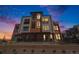 Modern three-story brick townhome with a metal balcony at 2680 Westview Way # 55, Superior, CO 80027