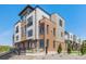 Modern three-story brick townhome with a metal balcony at 2680 Westview Way # 55, Superior, CO 80027