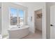 Bathroom with a soaking tub and separate toilet area at 2680 Westview Way # 55, Superior, CO 80027