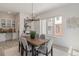 Bright dining area with wood table and modern chandelier at 2680 Westview Way # 55, Superior, CO 80027