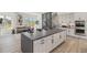 Open concept kitchen with island and views into living room at 2680 Westview Way # 55, Superior, CO 80027