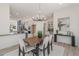 Bright dining room features a wood table and modern chandelier at 2680 Westview Way # 55, Superior, CO 80027