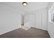 Simple bedroom with carpet and double door closet at 25584 E Byers Dr, Aurora, CO 80018