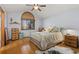 Main bedroom with metal bed frame and wood floors at 1749 Foster Dr, Longmont, CO 80501