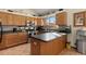 Bright kitchen with stainless steel appliances and an island at 1749 Foster Dr, Longmont, CO 80501