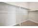 Large walk-in closet with double hanging rods and shelving at 5970 S Platte Canyon Dr, Littleton, CO 80123