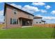 Home exterior showcasing a large backyard and patio at 954 Plum Creek Ct, Brighton, CO 80601