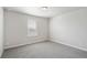 Bright bedroom featuring neutral walls and carpeted floors at 954 Plum Creek Ct, Brighton, CO 80601