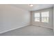 Well-lit bedroom with neutral walls and carpet flooring at 954 Plum Creek Ct, Brighton, CO 80601