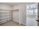 Large walk-in closet with built-in shelving at 954 Plum Creek Ct, Brighton, CO 80601