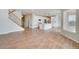 Open concept kitchen with island, white cabinets, and stainless steel appliances at 954 Plum Creek Ct, Brighton, CO 80601