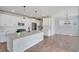 Modern kitchen with white cabinets, quartz countertops, and a large island at 954 Plum Creek Ct, Brighton, CO 80601