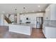Modern kitchen with white cabinets, quartz countertops and black hardware at 954 Plum Creek Ct, Brighton, CO 80601