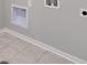 Laundry room with tile floor and built in shelving at 954 Plum Creek Ct, Brighton, CO 80601