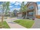 Houses with similar architectural styles and well-maintained landscaping at 954 Plum Creek Ct, Brighton, CO 80601