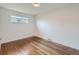 Well-lit bedroom with hardwood floors and a window at 3612 Forest St, Denver, CO 80207