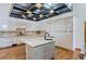 Modern kitchen with large island and wood flooring at 135 Poorman Rd, Boulder, CO 80302