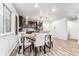 Modern kitchen with dark cabinets, stainless steel appliances, and an island at 125 Mesa Way, Superior, CO 80027
