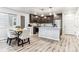 Modern kitchen with dark cabinets, stainless steel appliances, and an island at 125 Mesa Way, Superior, CO 80027