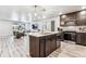 Open concept kitchen features island and stainless steel appliances at 125 Mesa Way, Superior, CO 80027