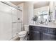Bathroom with shower, toilet and dark brown vanity at 125 Mesa Way, Superior, CO 80027