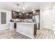 Modern kitchen with dark cabinets, stainless steel appliances, and an island at 125 Mesa Way, Superior, CO 80027