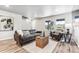 Living room with gray couches, a coffee table and side table, and hardwood floors at 125 Mesa Way, Superior, CO 80027