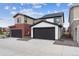 Exterior view of attached garage and neighboring homes at 125 Mesa Way, Superior, CO 80027