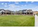 Community featuring several homes with green lawns and a central park area at 125 Mesa Way, Superior, CO 80027
