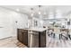 Modern kitchen with island, stainless steel appliances, and dining area view at 125 Mesa Way, Superior, CO 80027