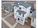 Two-story home in a new development, featuring a gray roof and white exterior at 13485 E 103Rd Ave, Commerce City, CO 80022